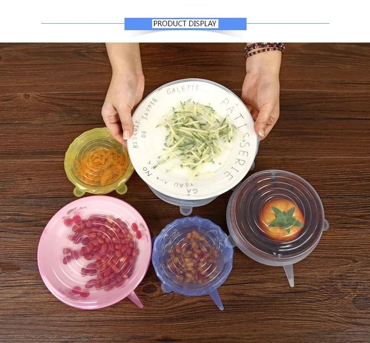 Reusable silicone stretch lids in pink, blue, yellow, and transparent on wooden table