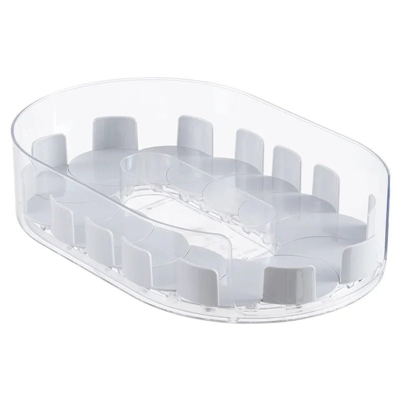 Clear oval rotating turntable base with raised slots for bottles and cans
