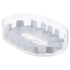 Clear oval rotating turntable base with raised slots for bottles and cans