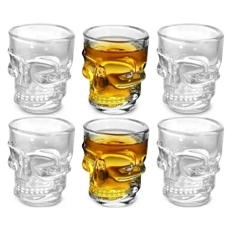 Set of skull head shot glasses: clear and golden amber versions, round rims