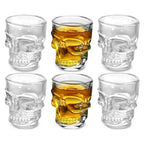 Set of skull head shot glasses: clear and golden amber versions, round rims