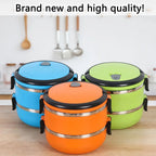 Set of stackable stainless steel bento lunch boxes in blue, green, and orange