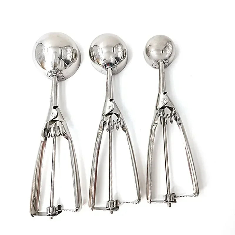 Set of stainless steel spring scoops with round bowls and scissor-style release levers