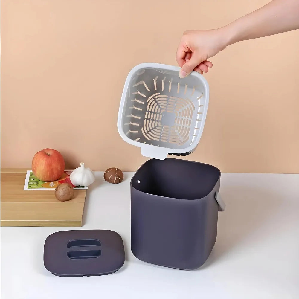 Navy countertop compost bin with open lid and removable inner vented tray