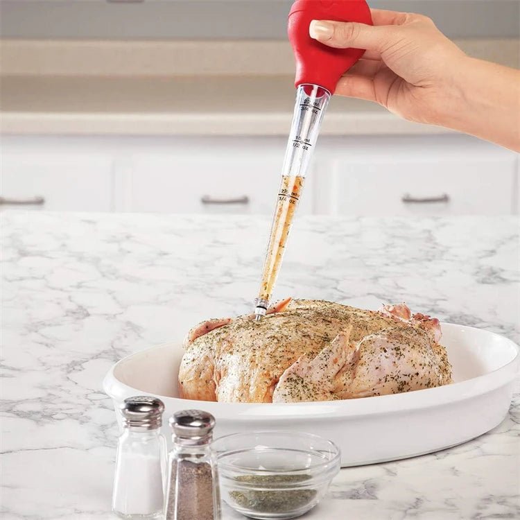 Hand holding red meat injector inserting seasoning into roast in a white dish