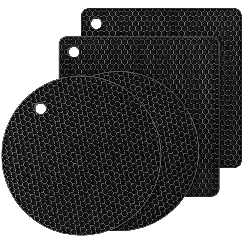 Set of black hex-pattern silicone trivet mats: two round and two rectangular pads with holes