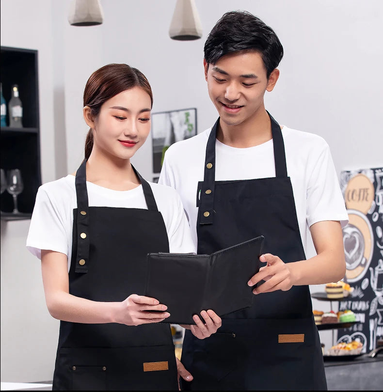 Black waterproof canvas chef apron with front pocket and adjustable neck