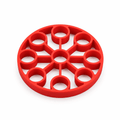 Red silicone 9-hole egg steamer rack, top view with circular openings