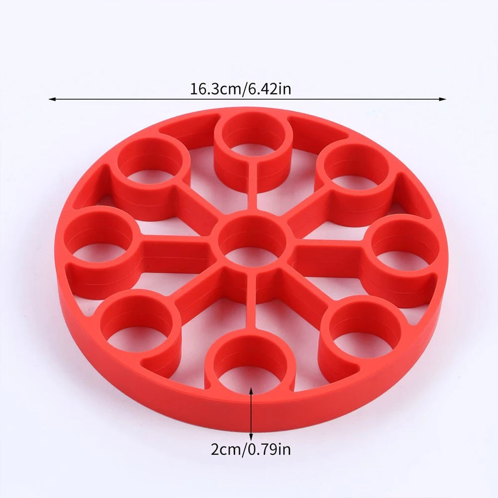 Red silicone 9-hole egg steamer rack, 16.3 cm diameter and 2 cm well size