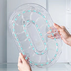 Clear oval turntable lid with bottle slots for 360° rotating refrigerator storage