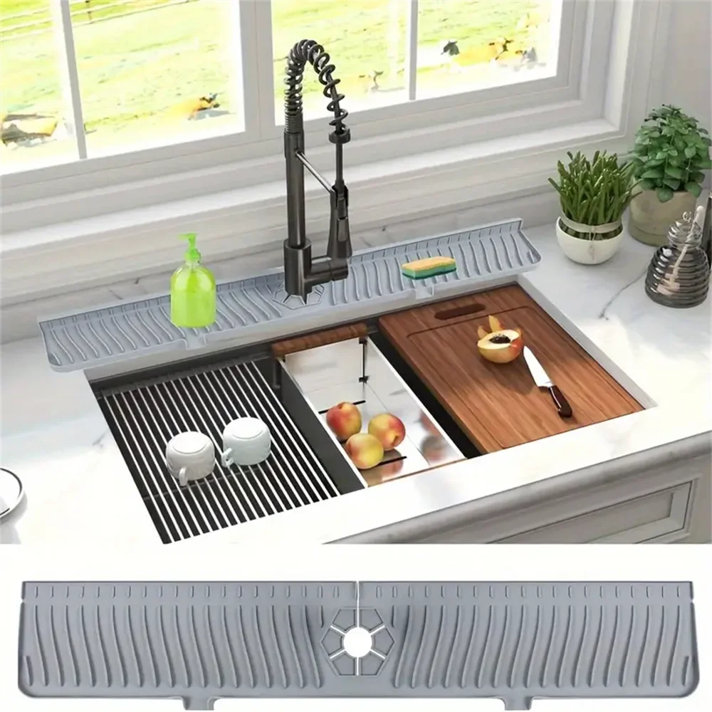 Gray silicone sink splash guard and drain mat installed across the sink near faucet