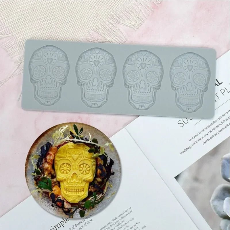 Silicone skull-face cake border mold with four cavities in light gray