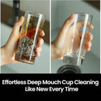 Stainless steel chainmail scrubber pieces in a clear cup container, held in hand