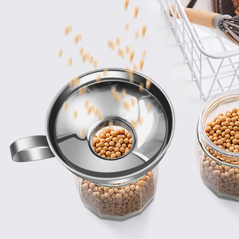 Stainless steel canning funnel over jar, wide mouth and side handle