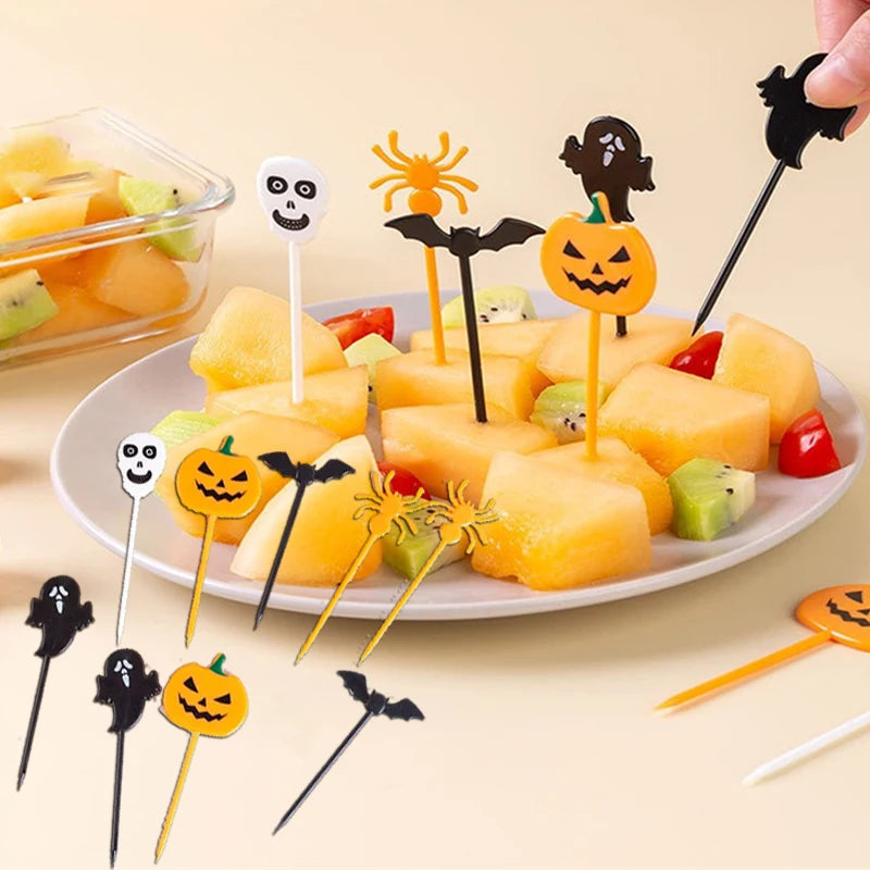 Plastic Halloween cupcake toppers with pumpkin, ghost, bat, and spider icons on sticks