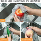 Grey non-scratch mesh cloth washing fruit and vegetables at a kitchen sink