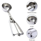 Stainless steel spring scoop close-up showing reinforced spring, scraper, and thick gear