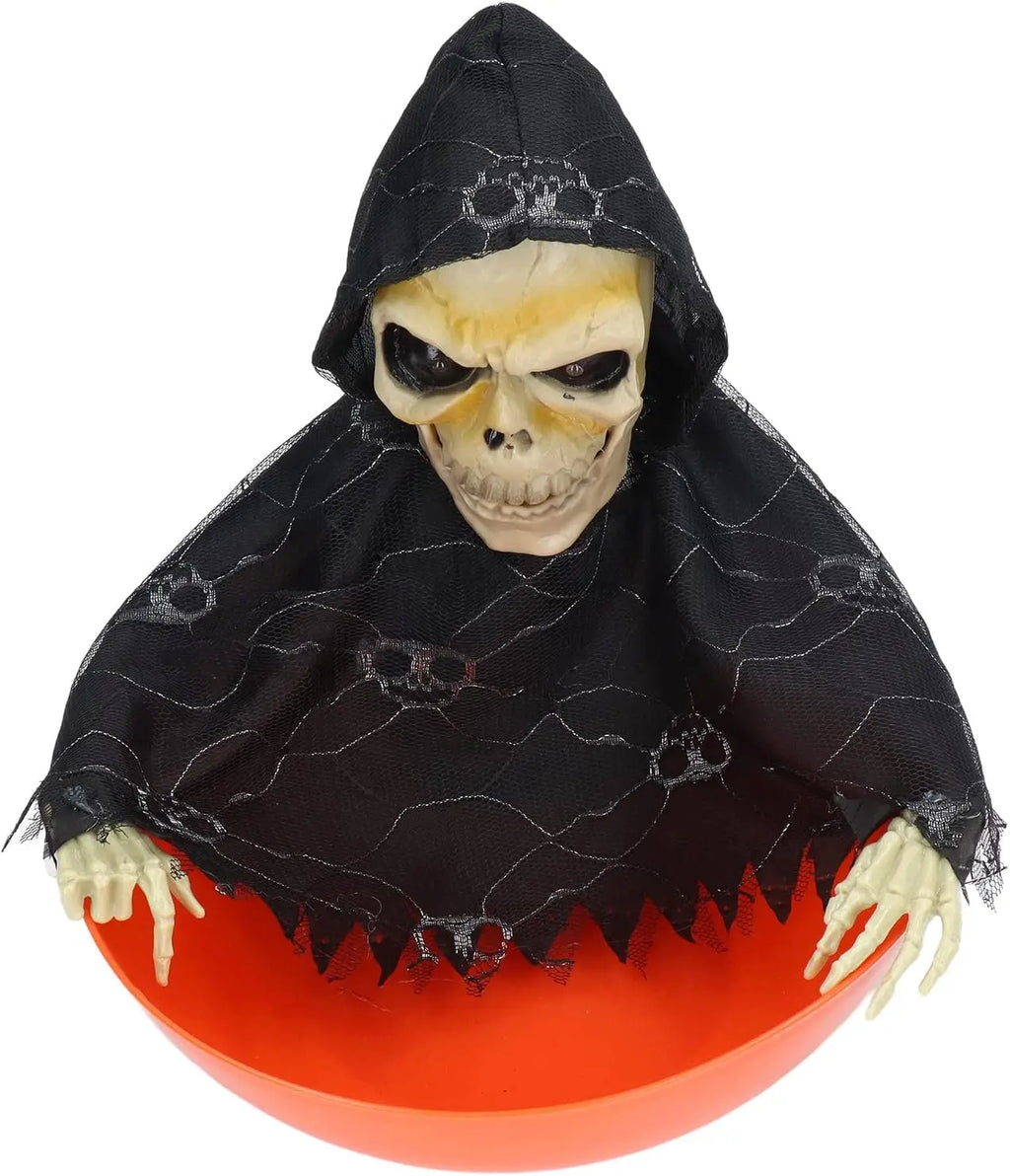 Orange skull bowl haunted prop with hooded skeleton face, arms and hands visible